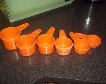 Vintage Tupperware Measuring cups in brilliant orange - 6 piece set