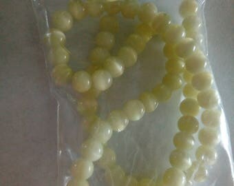 Set of 71 clear yellow glass beads