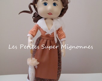 Fofucha Provencal doll holding an umbrella