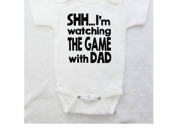 Funny Baby Bodysuit "Shh...Im watching the game with dad" for Boy or Girl - Baby Boy Clothes | Baby Girl Clothes | White Bodysuit