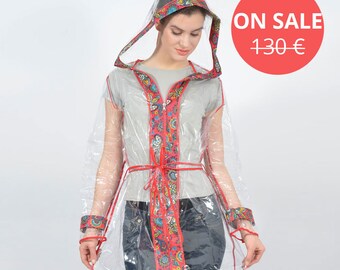 A transparent raincoat - Red border with abstract flowers