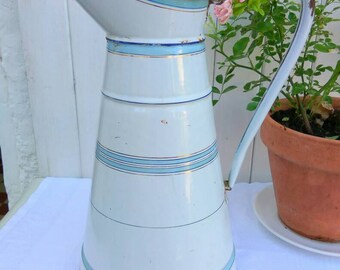 A vintage French enamelware water pitcher. Large blue, gold and white jug, home or garden decor.
