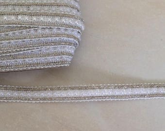 Braid has customize beaded in the middle of 1 cm and Silver trim white color