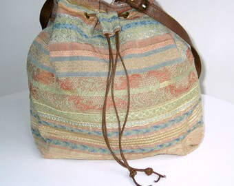 Drawstring bucket bag, shoulder bag, handbag. Made from all UPCYCLED materials.