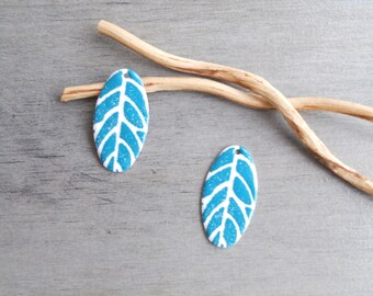 X 2 sequins oval turquoise and white 30 x 16 mm