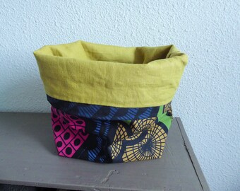 Empty pockets in pink, green, black, beige and blue patterned fabric