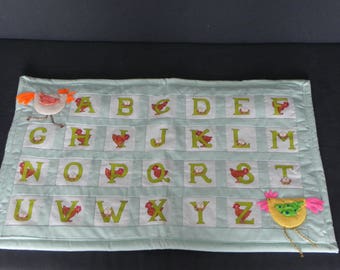 Green alphabet or when madame chicken teaches us the alphabet