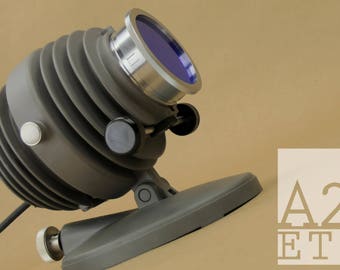 Unique Vintage Industrial Focus Spot Light with Soft Blue Lens that looks military for desk or display. Great accent conversation piece.