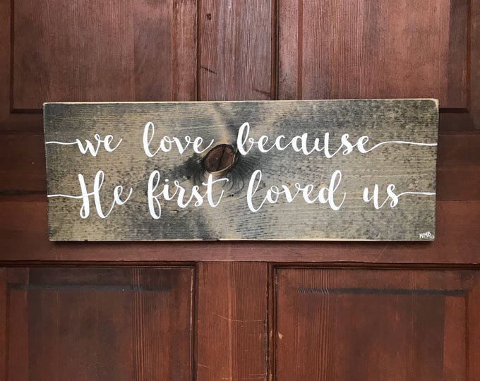 He Loved Us First hand-painted wood sign