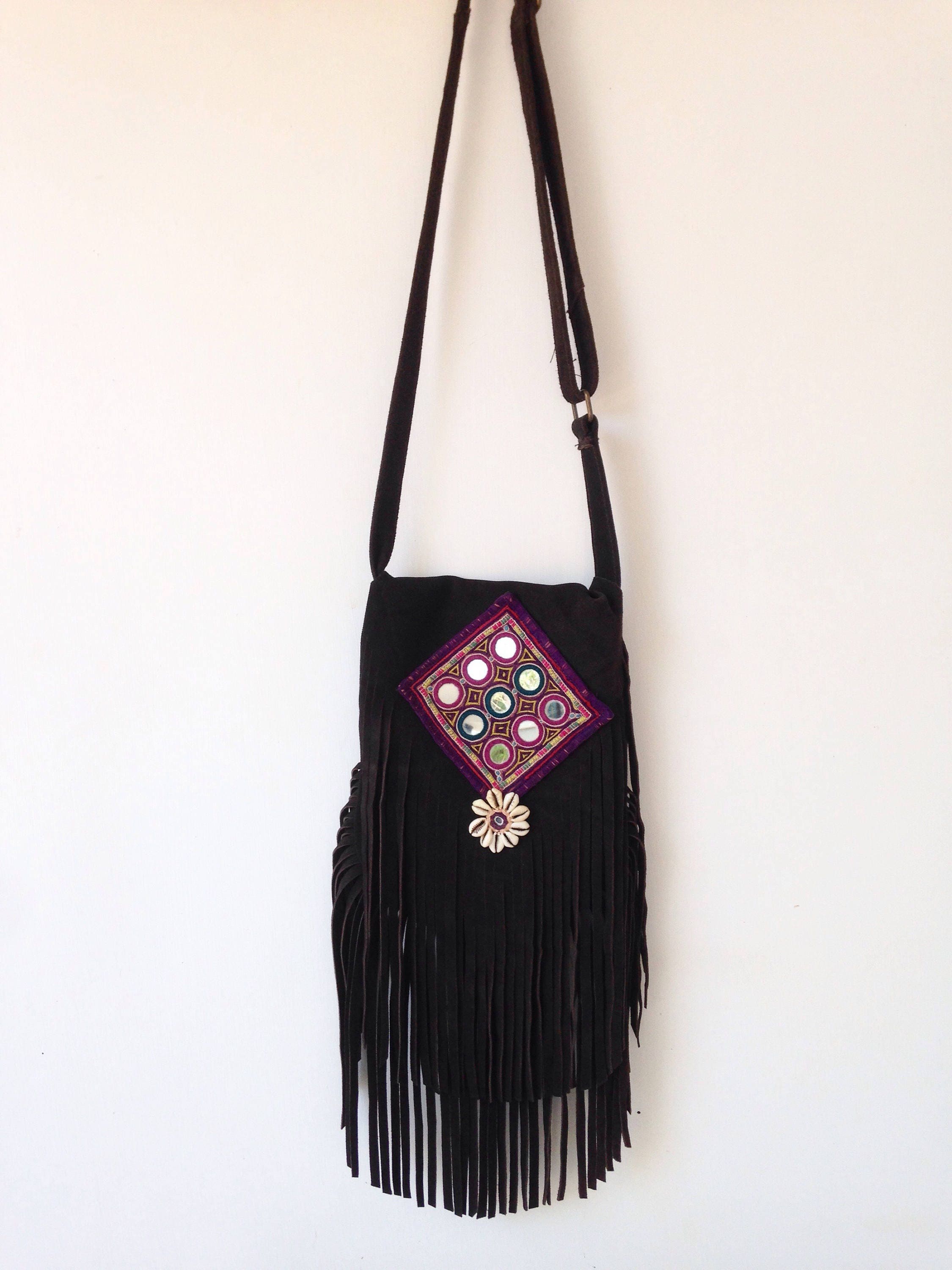 Brown leather fringe bag with tribal swatch and cowrie shells