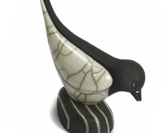 Bird on Pebble feeding - ceramic raku fired sculpture