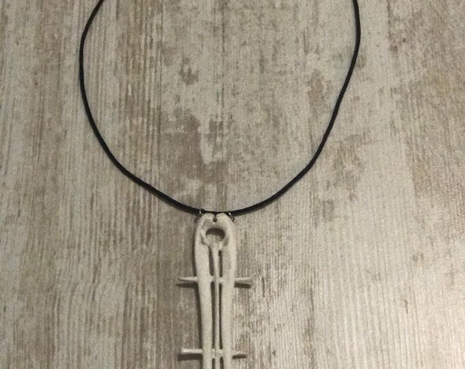 Very beautiful unisex pendant. Made of bones.