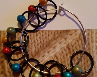 12 medium sized snag free ring style knitting stitch markers . Brights