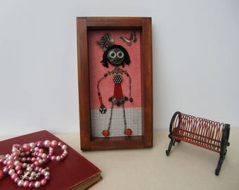 Small unique figurines made of antiques. Wood frame, girl's room.