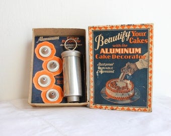 Vintage aluminum cake decorating set in original box