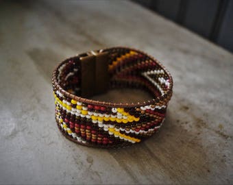 Brazilian glass Burgundy and bronze metallic.