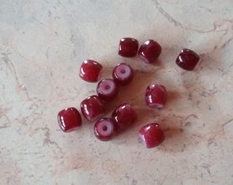Opaque white mottled dark red glass oval beads
