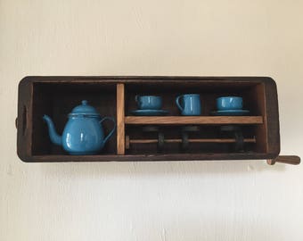 Tea Set Automata - vintage dolls tea set spinning in an old sewing machine drawer.