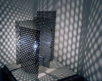 Metal lamp design in steel with tissu cable.