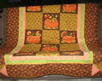 Throw quilt for cool evenings fits outdoor bench swing, your chaise lounge, couch... 71.5" X 53". Fun pumpkin fabrics with pumpkin quilting.