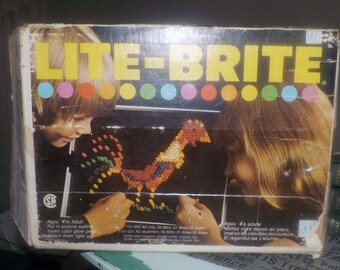 Vintage (c.1980s) Classic Hasbro Lite Brite toy. Original box, 30 refills, large tub of colored pegs. Tested and fully functioning!