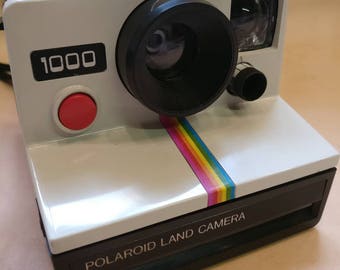 Vintage Polaroid 1000 camera with hard case