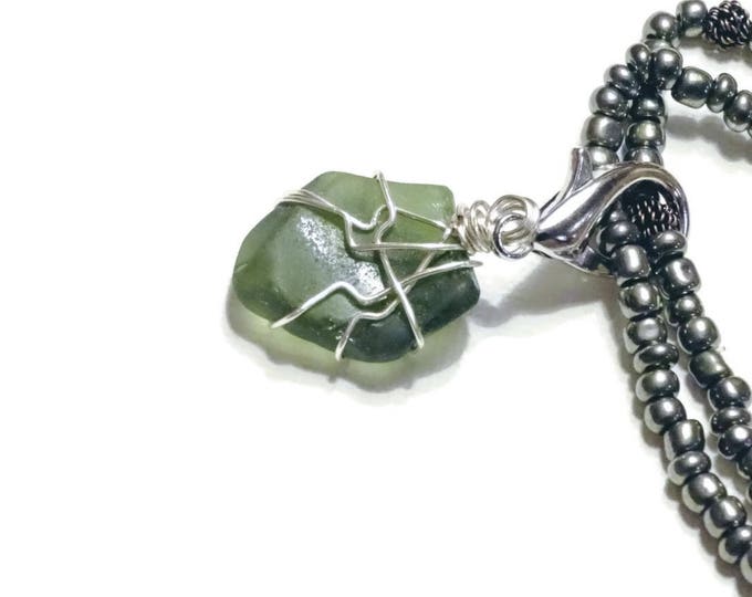 Beaded Bracelet - Rare Olive beach glass charm - gun metal gray beads - stretch bracelet - shiny - Pretty and Beachy