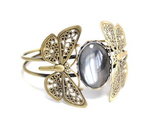 Bracelet holder butterflies with clear glass oval cabochon