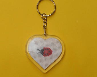 Heart shaped key chain with a ladybug