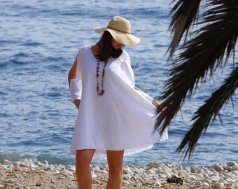 Summer dress, white cotton with big flowers embroidered. Long sleeves. Beautiful dress for the beach!