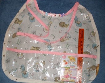 Precious Moments Bib ABDL Clear Plastic Crumb Catcher with (2) 24pc Puzzles