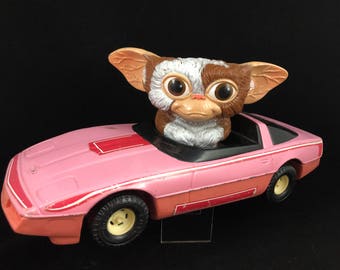 gizmo driving barbie car