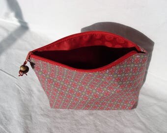 Coated canvas zippered pouch.