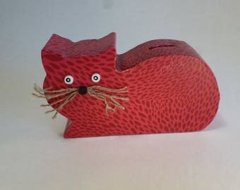 The scroll saw-cut wooden cat piggy bank