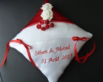 embroidered red and white cushion