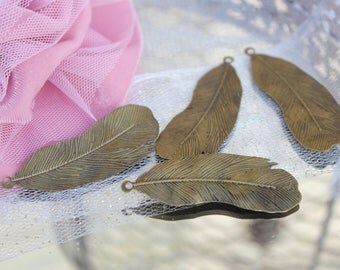 Lot de 4 plumes bronze -dim 5,3 cm X 1,8 cm