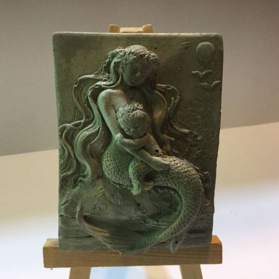 large concrete mermaid statue