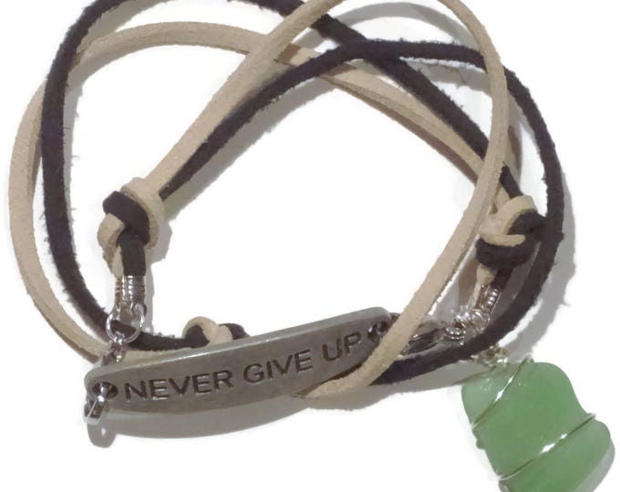 Strappy bracelet "Never Give Up" Medallion Green beach glass charm with tan and black leather laces and lobster claw closures