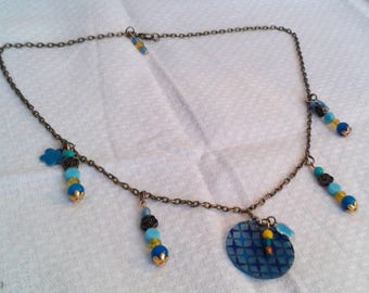 Blue flowers and bronze necklace