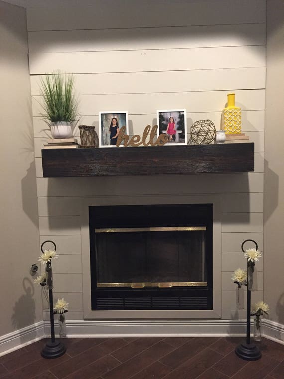 FLOATING FIREPLACE MANTEL/ SHELF  Rugged finish wood fireplace mantle. Look of a solid beam. Made out of wood
