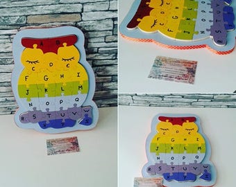 Wooden puzzle, owl, containing 26 pieces. With its base from storage.