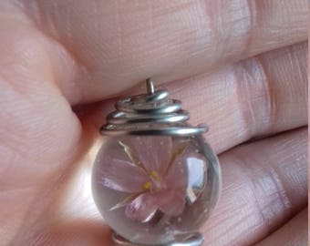 Pendant with natural flower inside transparent sphere