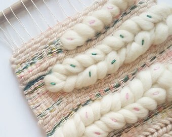 EVERY CLOUD woven wall hanging | Modern wall art in soft colour palette of Pink, Ivory & Green with bead detail | Feminine tissage
