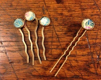 Blue and pink hair comb or hair stick.