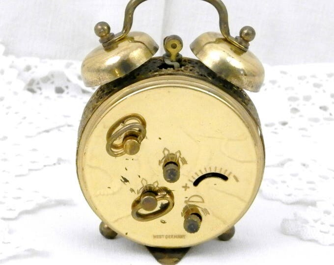 Small Working Vintage West German 1960s Metal Mechanical Wind Up Alarm Clock with Roman Numerals and Filigree Decoration, Mid Century Small Working Vintage West German 1960s Metal Mechanical Wind Up Alarm Clock with Roman Numerals and Filigree Decoration, Mid Century
