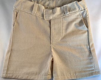 Boys tan stripe, gray stripe, or navy stripe seersucker shorts. Seersucker shorts available in boys sizes 12 months through size 7 boys
