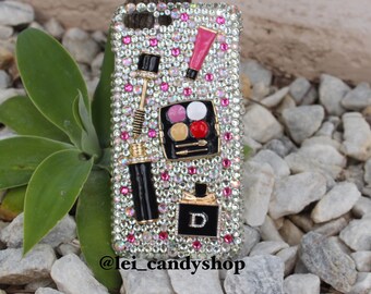 Make up lover bling phone case with a metal mascara, lipgloss, eyeshadow palette and a Dior perfume with clear, AB and pink crystals