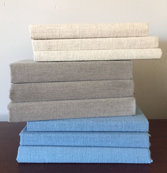 Linen covered books vintage decor blue beige gray shelf