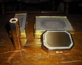 An Avon compact with matching lipstick holder. NIB
