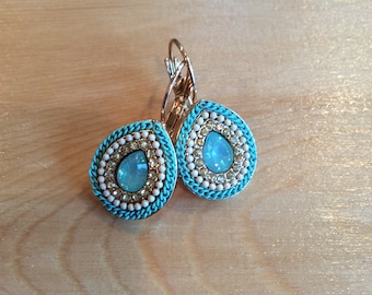 Lever back turquoise rope, white beads,and clear cz with a light blue center stone